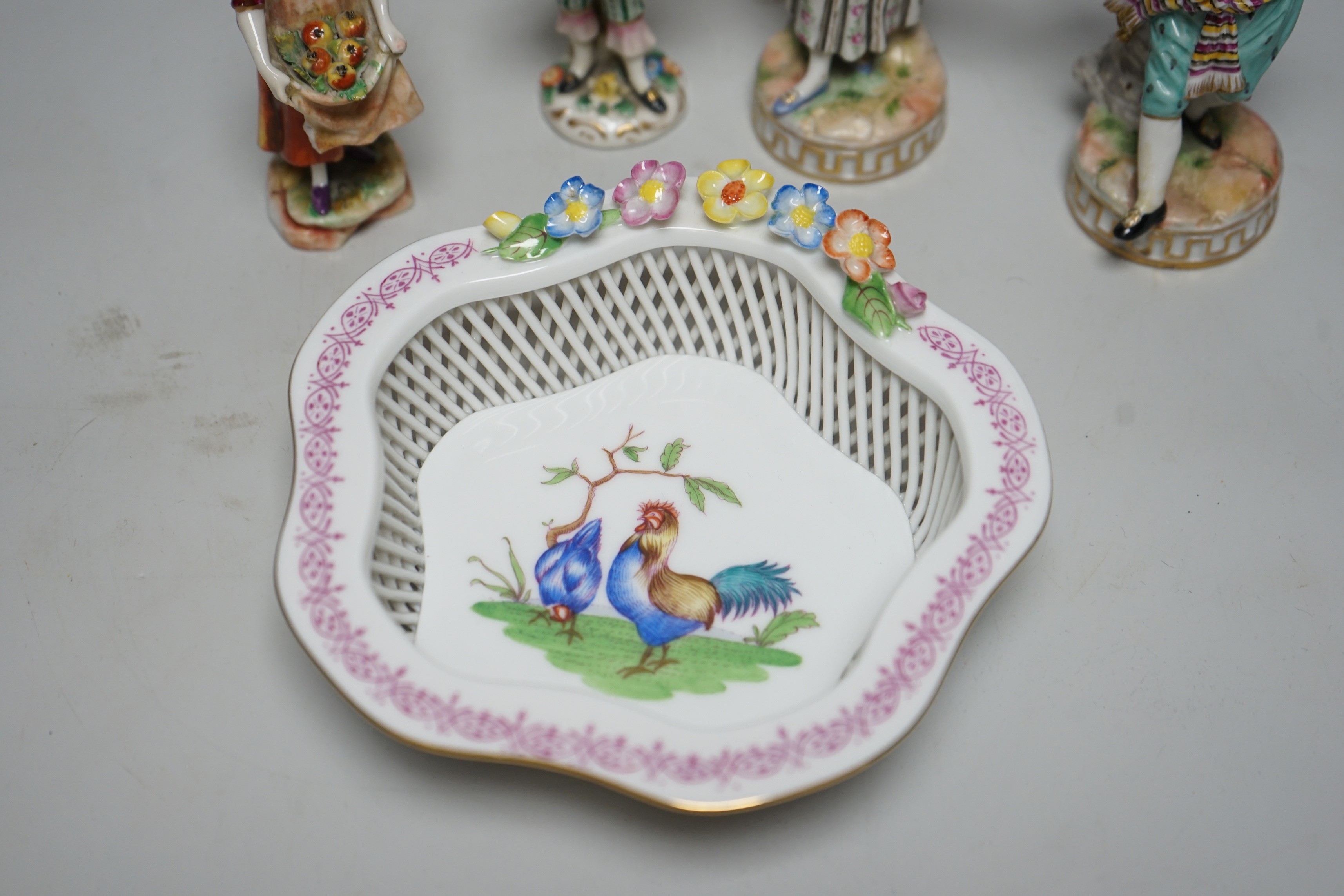 A Herend basket dish and two pairs of Continental figures